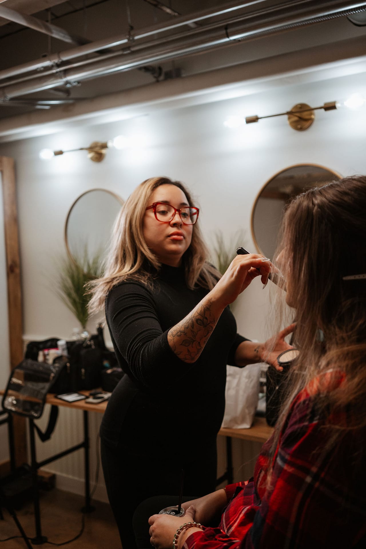 makeup artist doing bride's makeup