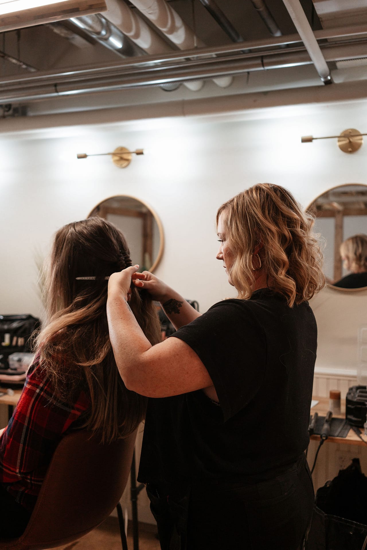 hair stylist doing bride's hair