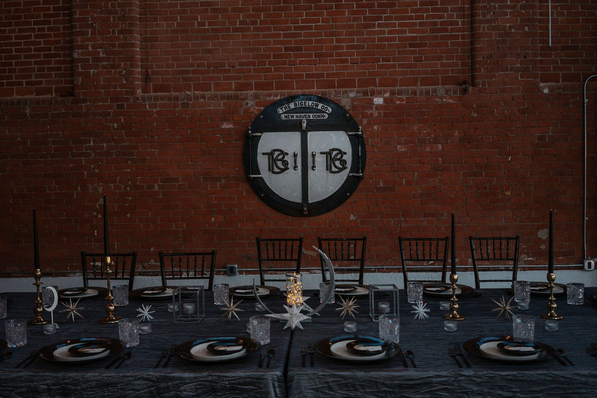 wedding reception table with venue sign displayed