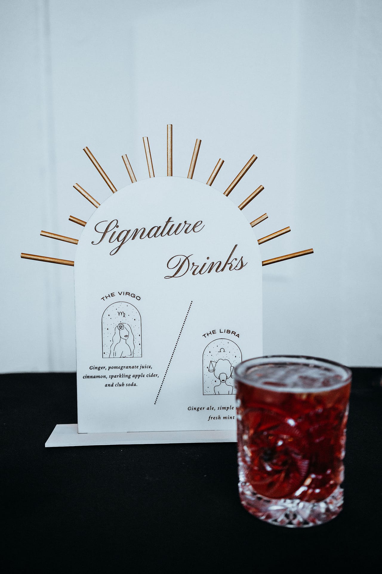 wedding drink menu with drink in front of it