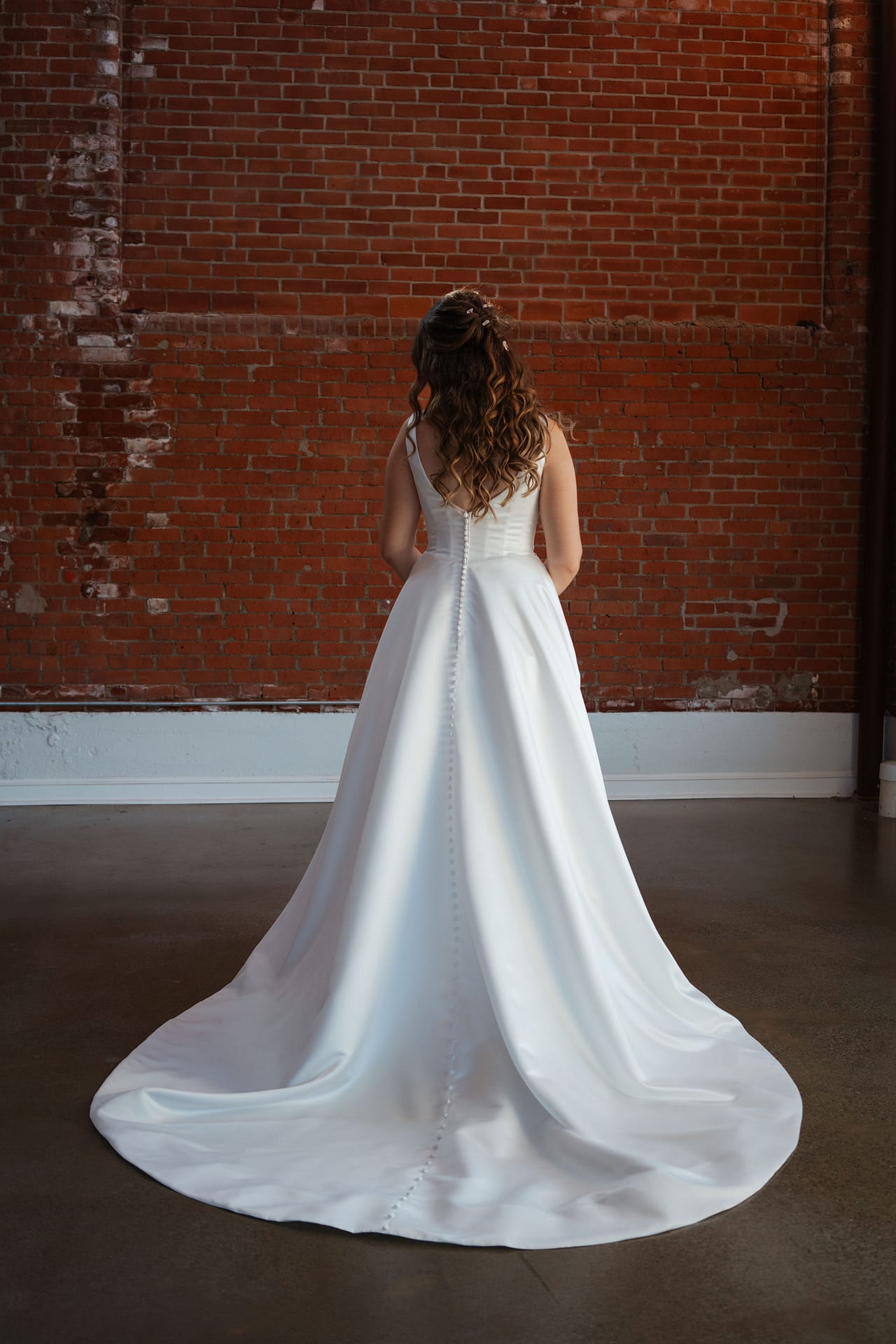 bride posing in elegant wedding dress