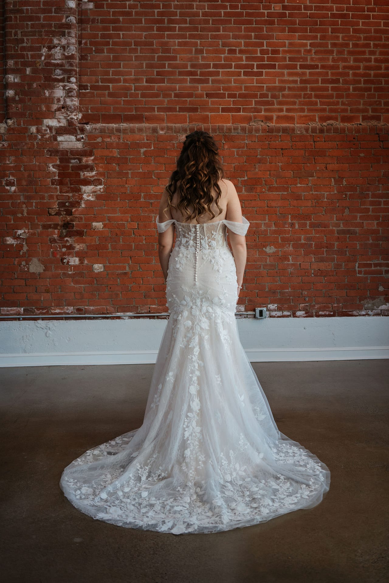 bride facing away in her wedding dress